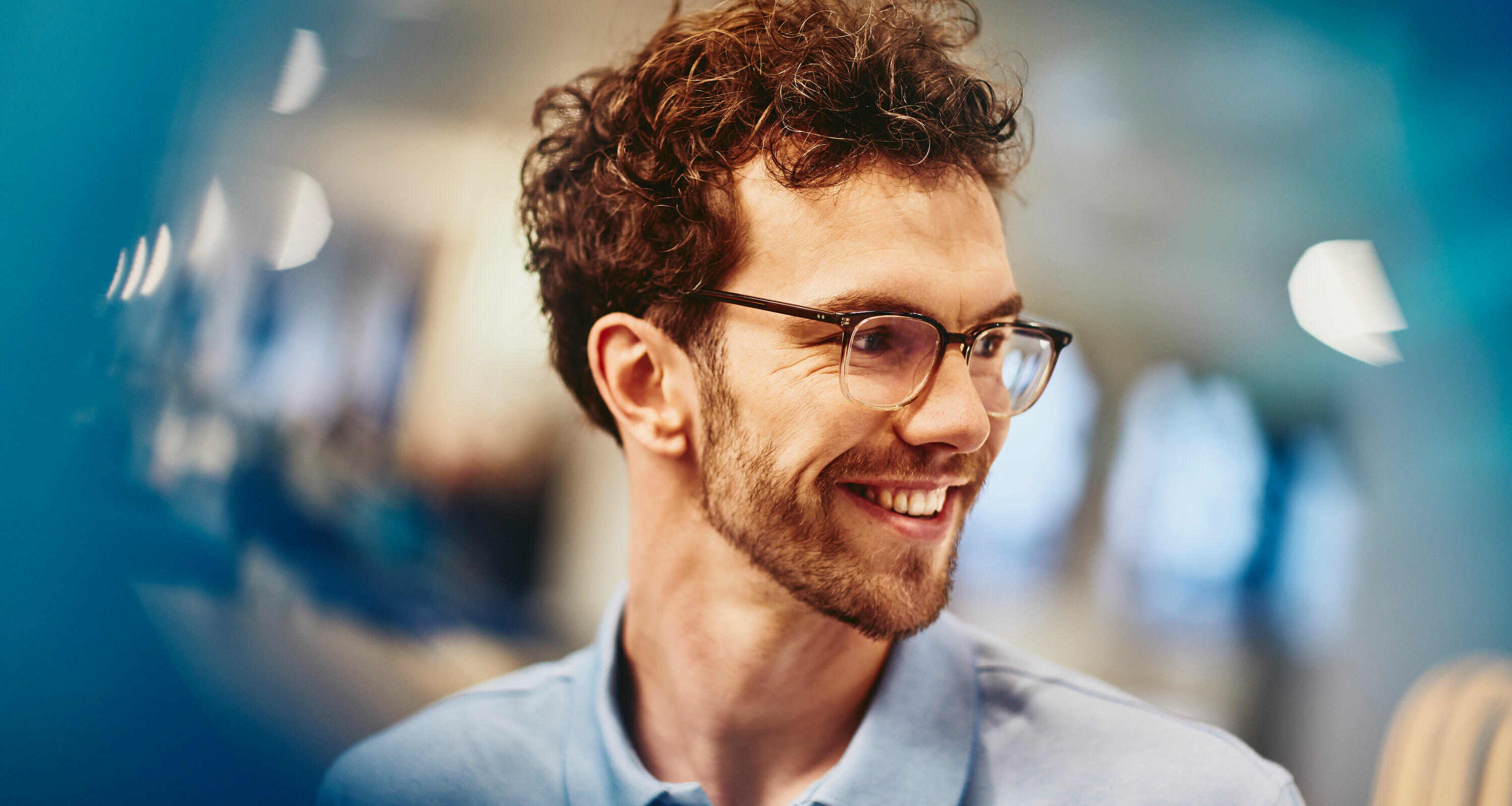 man with glasses smiling man with glasses smiling